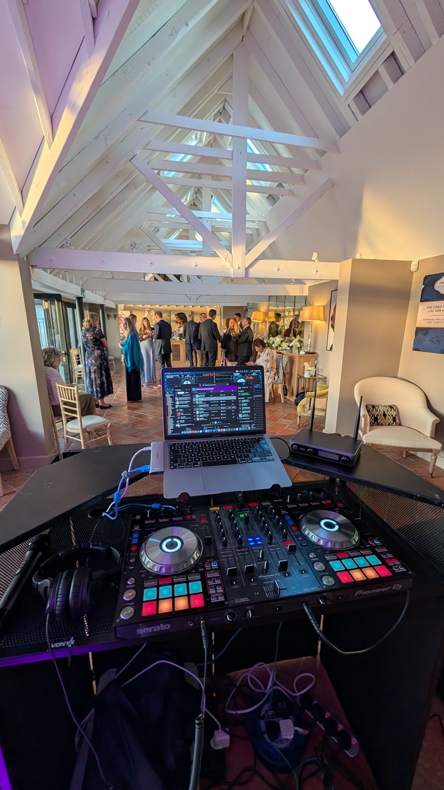 The view from behind the decks as guests arrive for a drinks reception